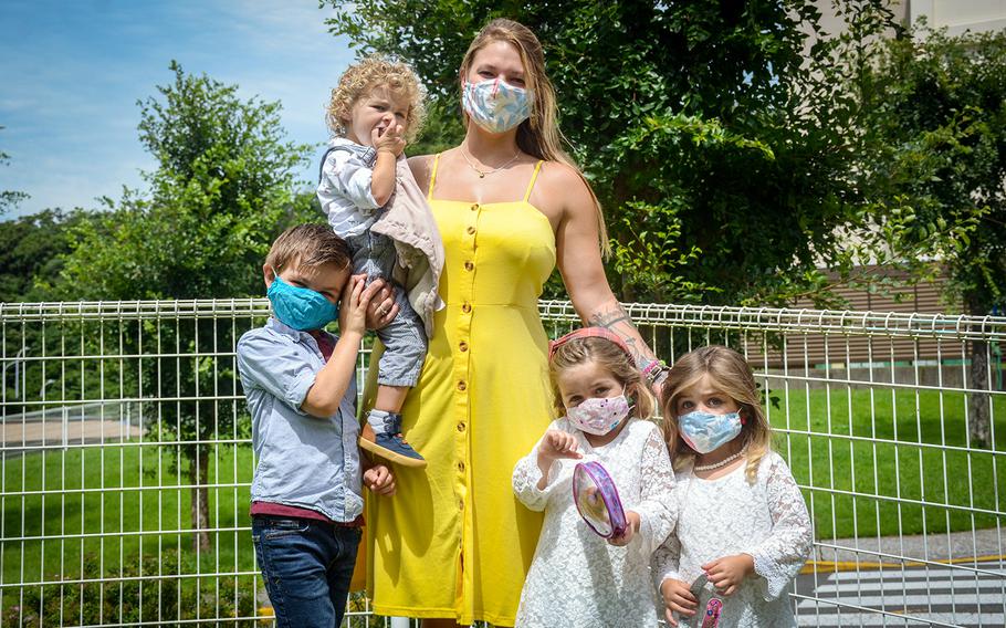 Navy spouse Bettie Annable poses with her children, from left to right, Liam, Ronan, Aurora and Audilyn, at the Ikego housing area near Yokosuka Naval Base, Japan, July 27, 2020.
