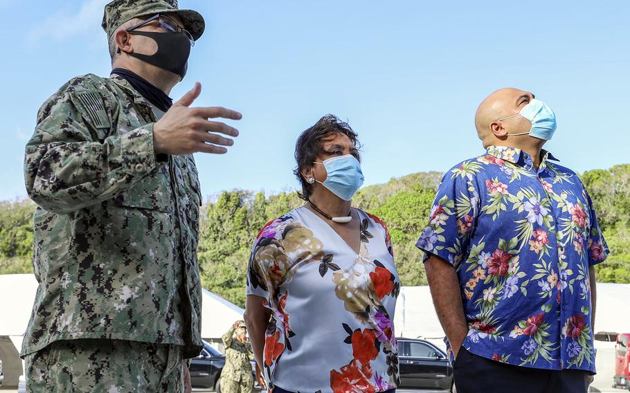 Guam Gov. Lou Leon Guerrero, center, and Lt. Gov. Josh Tenorio, right, check out the USS Theodore Roosevelt with Rear Adm. John Menoni, commander of Joint Region Marianas, at Naval Base Guam, May 21, 2020.