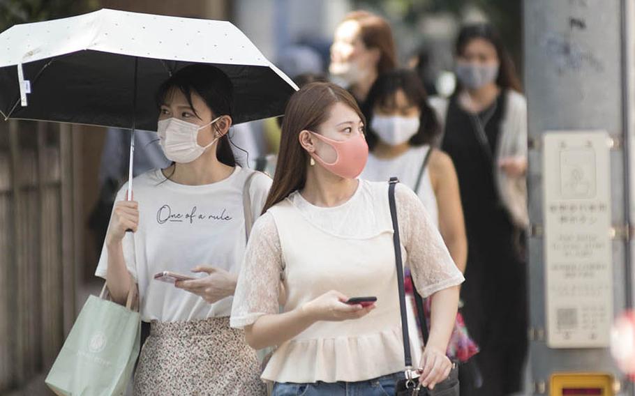 Pedestrians guard against the coronavirus in the Omotesando district of central Tokyo, Friday, Aug. 14, 2020. Akifumi Ishikawa/Stars and Stripes