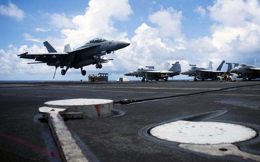 An F/A-18F of Strike Fighter Squadron 102 lands on the flight deck of the USS Ronald Reagan in the South China Sea on Aug. 14, 2020.