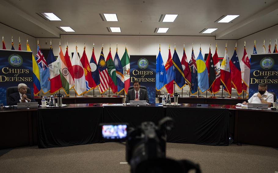 Moderator Ashley Tellis, from left, Defense Secretary Mark Esper and Indo-Pacific Command commander Adm. Phil Davidson participate in the Indo-Pacific Chiefs of Defense Conference, Tuesday, Aug. 25, 2020. 