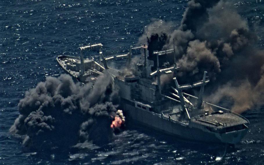 Smoke and fire billow from a decommissioned ship used in a sinking exercise during the Rim of the Pacific drills near the Hawaiian Islands, Aug. 30, 2020. U.S. Navy