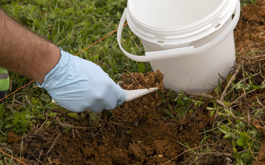 Soil samples are taken at Marine Corps Air Station Futenma, Okinawa, May 11, 2020, following a firefighting foam spill that happened a month earlier. 