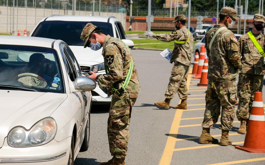 Soldiers assigned to the 2nd Infantry Division conduct coronavirus screenings at Camp Humphreys, South Korea, Aug. 17, 2020.