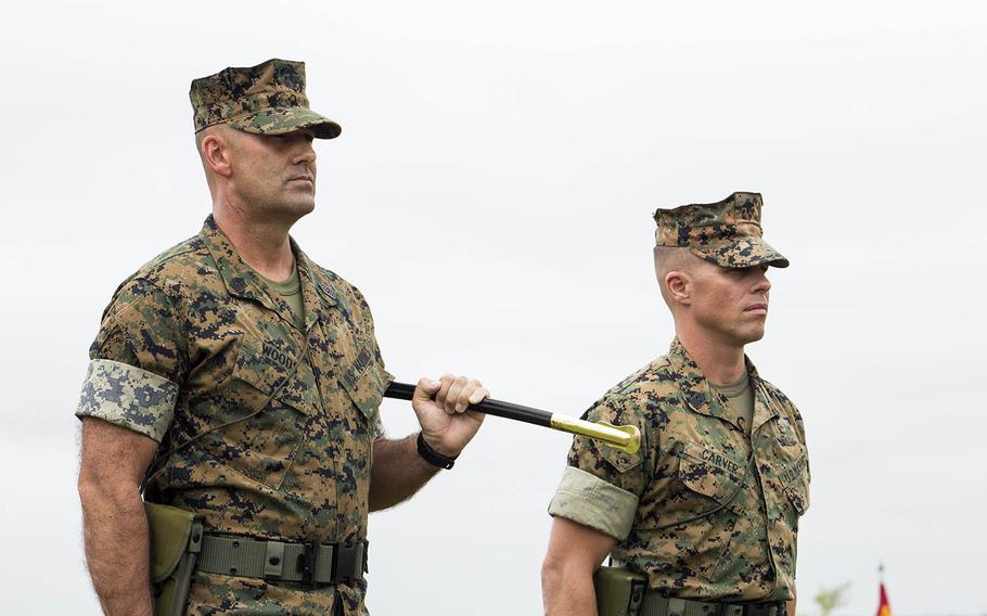 Marine Corps Sgt. Maj. Michael P. Woods, left, seen here in 2016 at Camp Lejeune, N.C., took over as sergeant major for III Marine Expeditionary Force on Okinawa, Aug. 4, 2020.