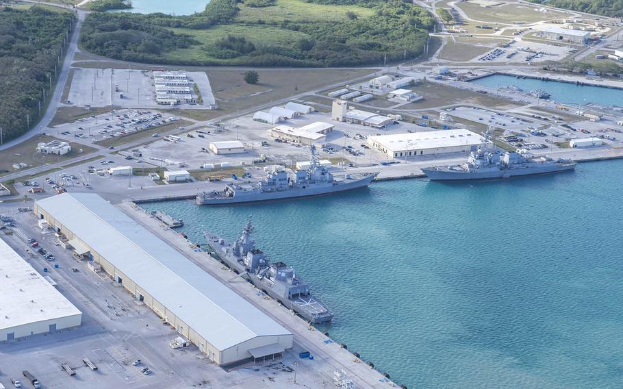 This aerial view of Naval Base Guam shows several Navy vessels moored at Apra Harbor, March 15, 2018.