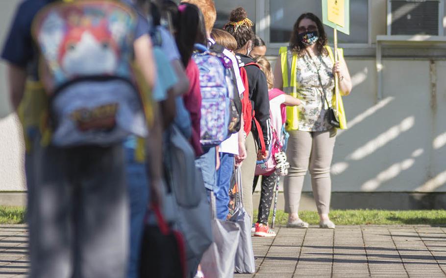 Sullivans Elementary School students line up for their first day of in-person classes at Yokosuka Naval Base, Japan, Monday, Sept. 28, 2020.