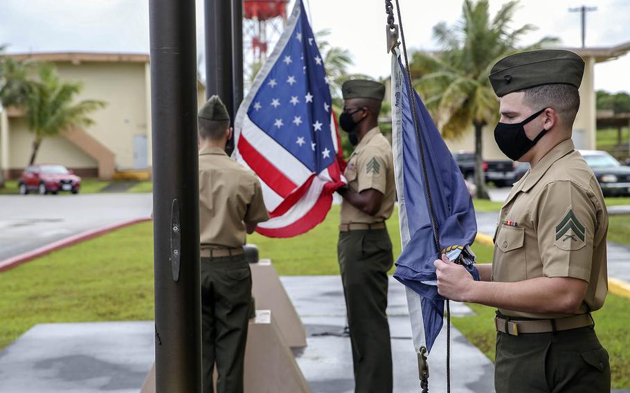 Marines raise flags for the first time at the new Camp Blaz on Guam, Thursday, Oct. 1, 2020.