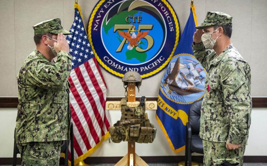 Capt. Gareth Healy, left, took command of Task Force 75 from Capt. Eric Correll, right, on Friday during a ceremony at Naval Base Guam, Friday, Oct. 2, 2020.