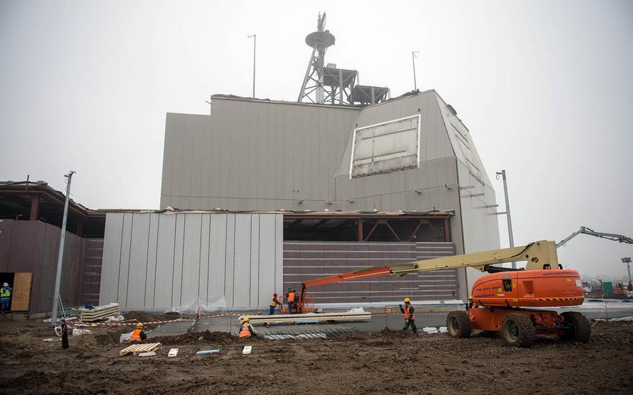 Sailors, along with American and Romanian contractors, construct an Aegis Ashore Missile Defense System at Naval Support Faculty Deveselu, Romania, Jan. 21, 2015.