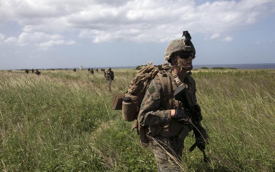 Marines patrol Ie Shima, Okinawa, after securing the Japanese island's airfield during Noble Fury drills, Wednesday, Oct. 7, 2020. 