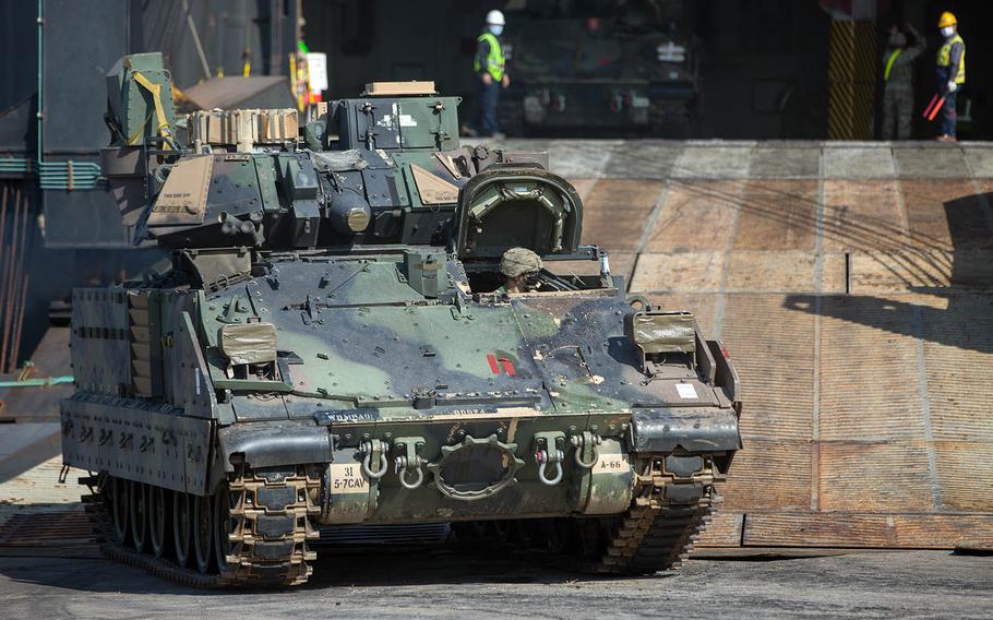Tracked armored vehicles from the Fort Stewart, Ga.-based 1st Armored Brigade Combat Team, 3rd Infantry Division arrive at Busan, South Korea, Thursday, Oct. 15, 2020.