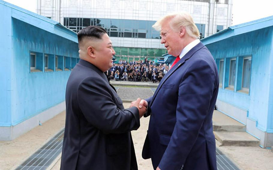 President Donald Trump speaks with North Korean leader Kim Jong Un on the North Korean side of the Joint Security Area, June 30, 2019.