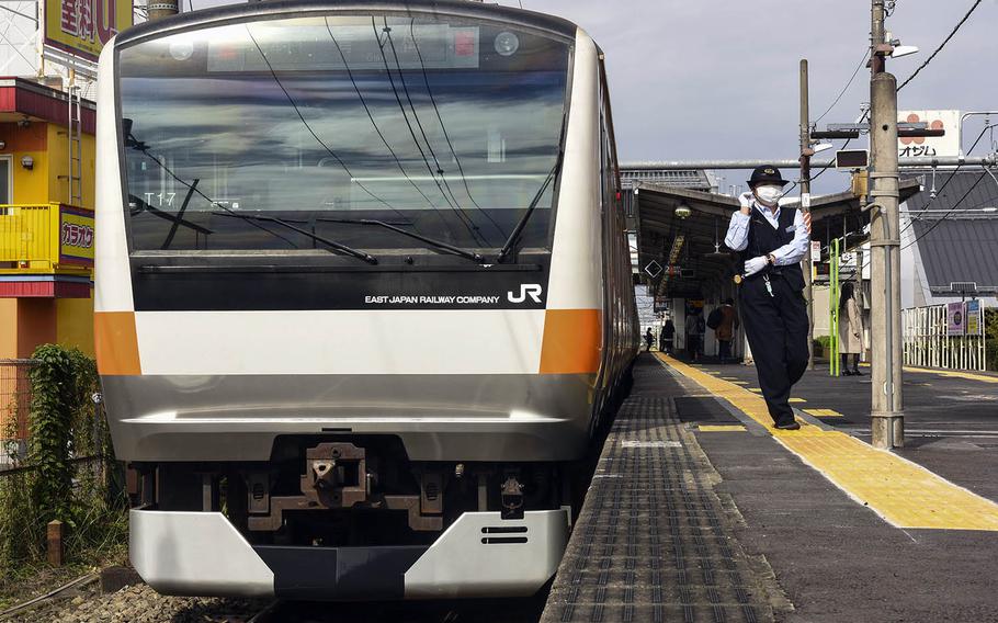 An Ome line train prepares to depart Ushihama Station, near Yokota Air Base, Japan, Thursday, Oct. 22, 2020.