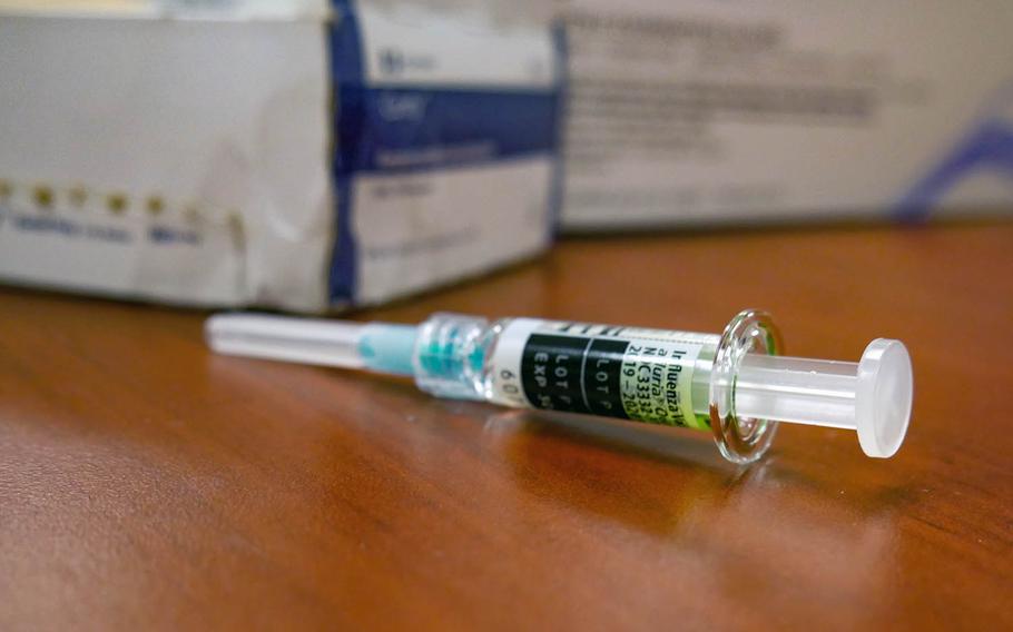 A flu vaccination shot rests on a table at 184th Sustainment Command headquarters in Monticello, Miss., on Feb. 8, 2020.