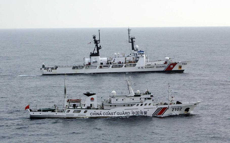 Vessels from the U.S. and Chinese coast guards sail alongside each other somewhere in the northern Pacific Ocean in 2014.