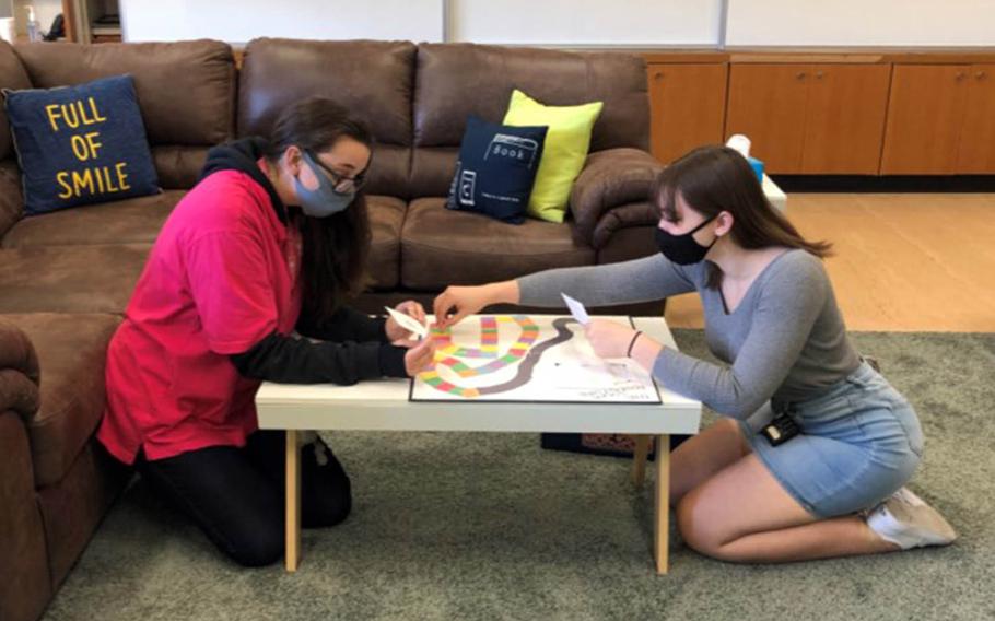 Edgren Middle/High School students Destiny Jagers, left, and Brianna Sanchez play a game while participating in the Pacific Students Transition Program at Misawa Air Base, Japan.