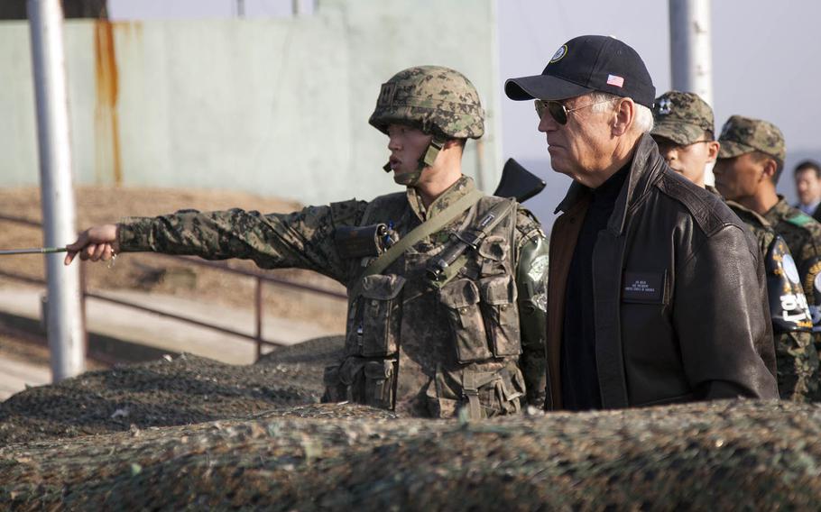 Then-Vice President Joe Biden looks out at North Korea from Observation Point Ouellette in the Demilitarized Zone, Dec. 7, 2013.