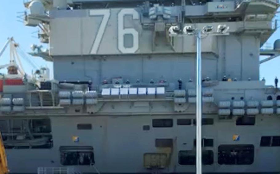 The aircraft carrier USS Ronald Reagan arrives at its homeport, Yokosuka Naval Base, Japan, in this screenshot from a live video on the carrier's Facebook page, Saturday, Nov. 14, 2020.