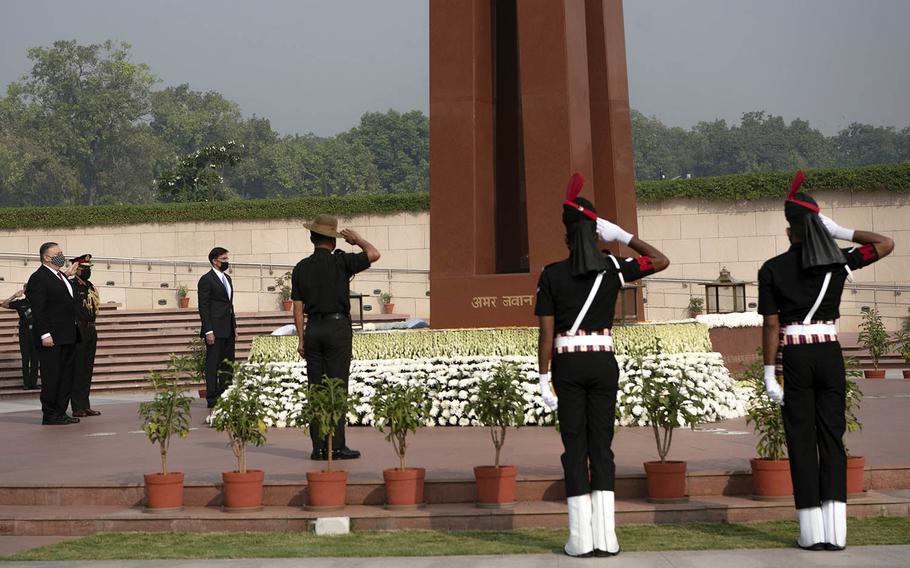 Secretary of State Mike Pompeo and then-Defense Secretary Mark Esper lay wreaths at the National War Memorial in New Delhi, India, Oct. 27, 2020.