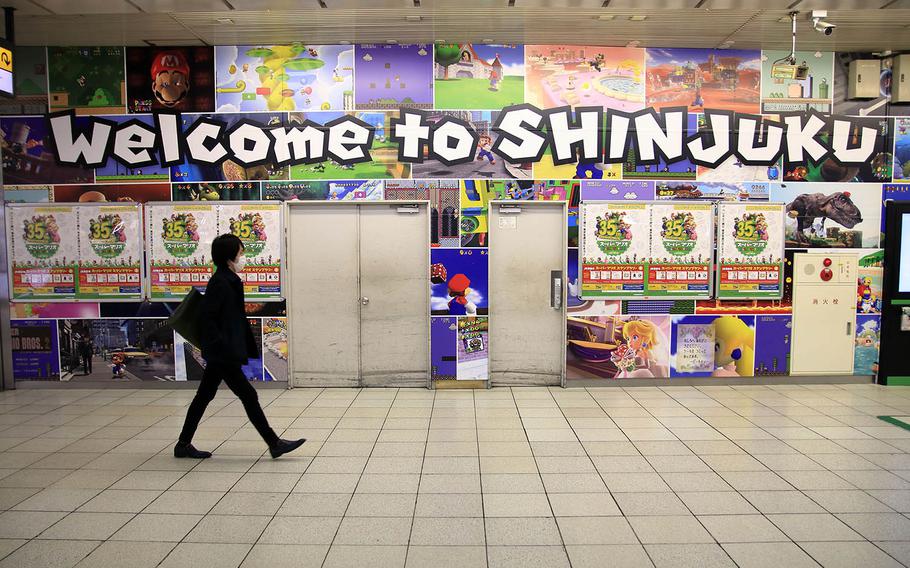 A wall display at Shinjuku Station in central Tokyo celebrates the 35th anniversary of the Super Mario Bros. video game franchise, Nov. 4, 2020.