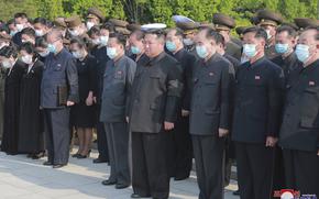 In this photo provided by the North Korean government, North Korean leader Kim Jong Un, center, attends a ceremony for Marshal of the Korean People's Army Hyon Chol Hae at a cemetery in Pyongyang, North Korea Sunday, May 22, 2022. Independent journalists were not given access to cover the event depicted in this image distributed by the North Korean government. The content of this image is as provided and cannot be independently verified. Korean language watermark on image as provided by source reads: "KCNA" which is the abbreviation for Korean Central News Agency. 