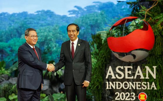 China's Premier Li Qiang, left, is greeted by Indonesia's President Joko Widodo upon his arrival at the 43rd Association of Southeast Asian Nations (ASEAN) Summit in Jakarta on Sept. 6, 2023. 