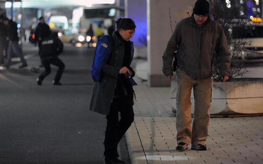 German police crime scene investigators  search for clues after the shooting of four Americans at Frankfurt International Airport on March 2, 2011.