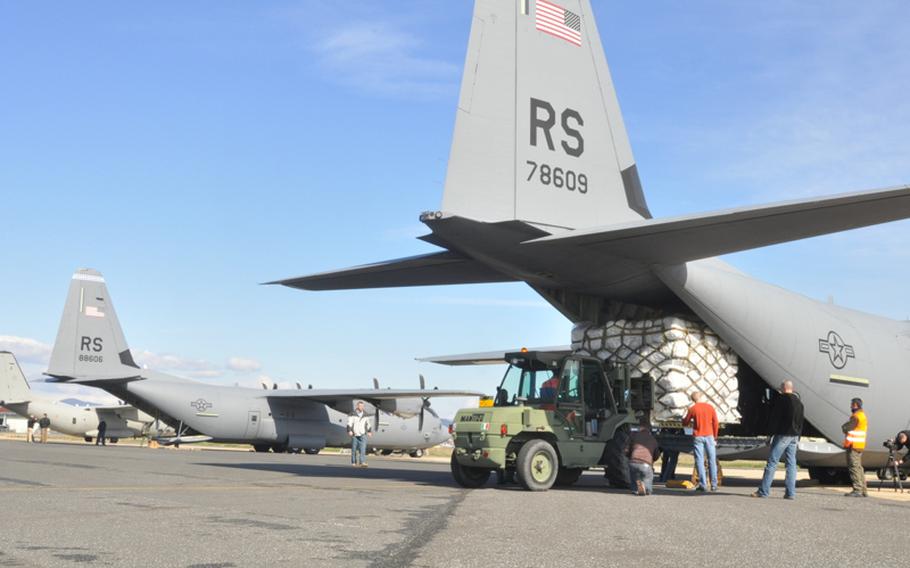 Two C-130 transport planes are loaded with supplies from the U.S. Agency for International Development, whose members will distribute the items to refugees fleeing the conflict in Libya. The supplies were loaded in Pisa, Italy, where the USAID houses materials at nearby Camp Darby.