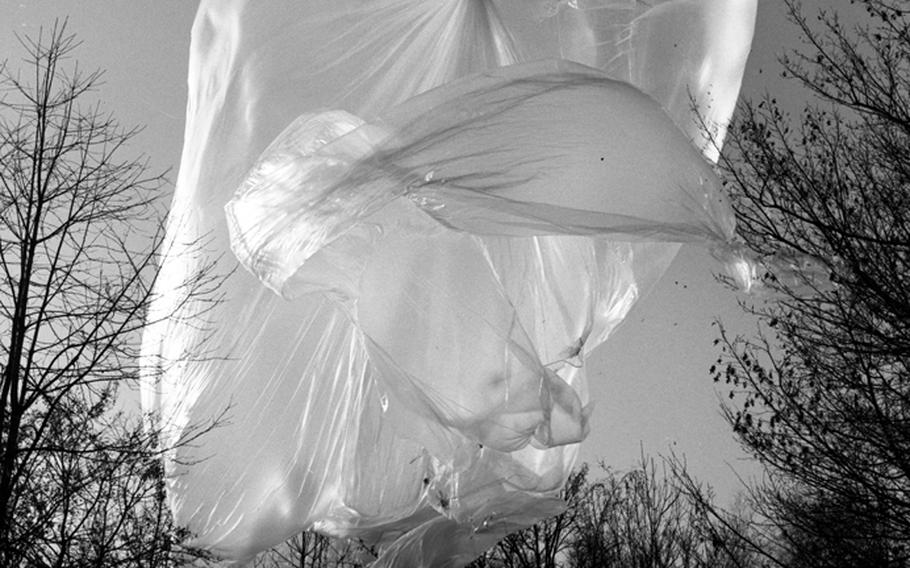 A weather balloon ends up in the trees after its launch at Giebelstadt, Germany, in 1956.