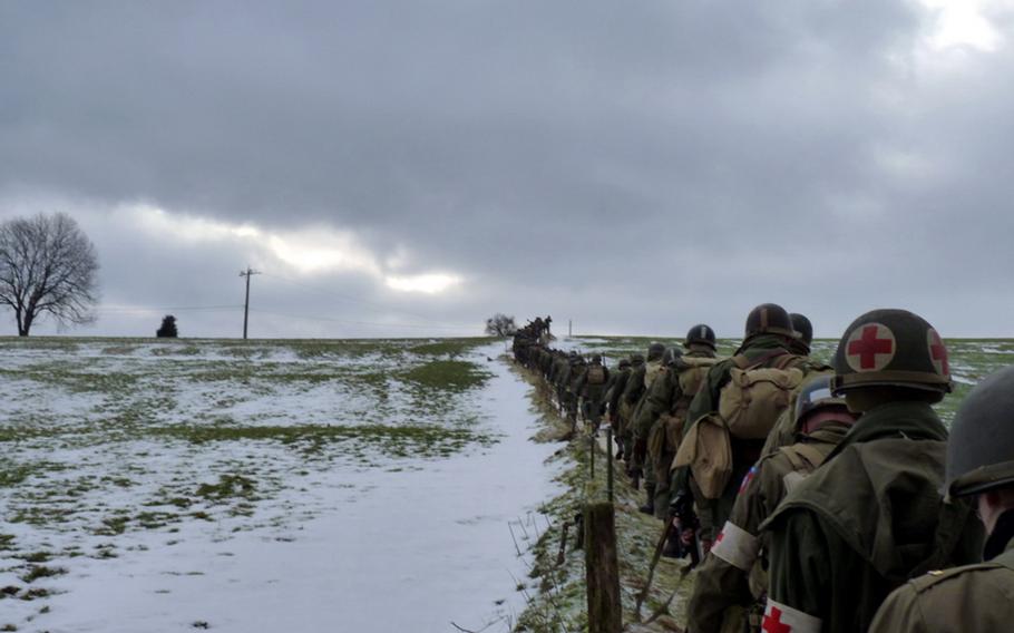 Re-enactors trudge along snowy fields in Belgium in February 2010 during an annual hike commemorating the exploits of the 82nd Airborne Division during the Battle of the Bulge.


