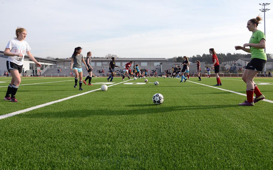 Members of the Kaiserslautern girls soccer team practice passing the ball as they get ready for the 2013 DODDS-Europe spring sports season. The Raisers are using their new stadium for track and field and soccer for the first time.

