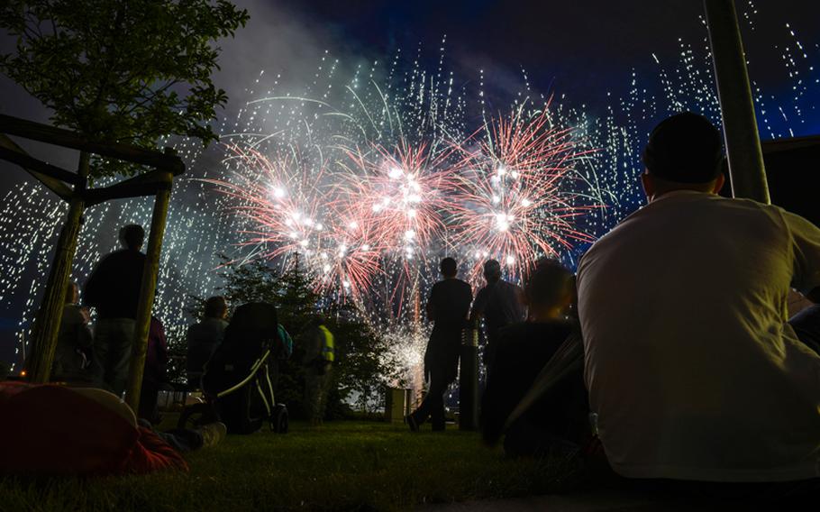 Attendees at the 2013 Independence Day celebration at Wiesbaden, Germany, watch fireworks July 3, 2013.