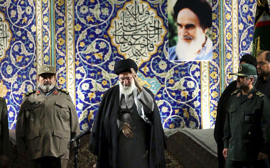 In this photo released by an official website of the Iranian supreme leader's office on Wednesday, Nov. 20, 2013, Iran's Supreme Leader Ayatollah Ali Khamenei waves to members of the paramilitary Basij force at the Imam Khomeini Grand Mosque in Tehran, Iran. Khamenei says pressure from economic sanctions will never force the country into unwelcome concessions as nuclear negotiators resumed talks with world powers. Khamenei also blasted U.S. government policies, including threats of military action, but said Iran has "no animosity'" toward the American people and seeks "friendly" relations. 