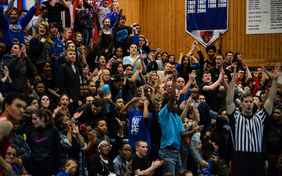 Ramstein fans react as their team made a three point shot in the second half Wednesday night against Kaiserslautern, Feb. 5, 2014.
