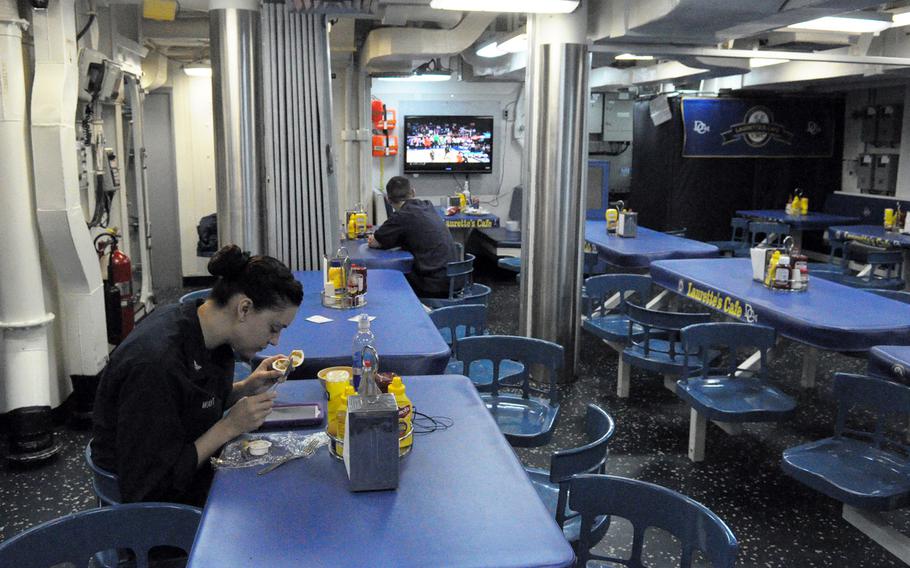 Sailors eat in the mess deck of the USS Donald Cook on Monday, Feb. 17, 2014. The Arleigh Burke-class guided missile destroyer arrived at its new home station in Rota, Spain, last week and is slated to make its first ballistic missile defense patrol in the coming month. 