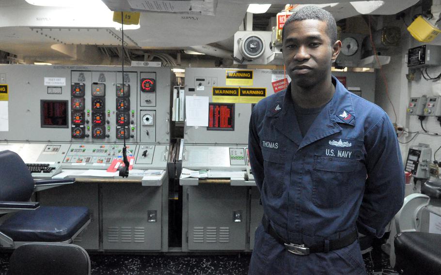 Petty Officer 2nd Class Sean Thomas, a machinist's mate from Inglewood, Calif., stands in the central control station of the USS Donald Cook, where the ship's propulsion, pitch and seawater pumps are monitored. The Arleigh Burke-class guided missile destroyer arrived at its new home station in Rota, Spain, last week and is slated for its first ballistic missile defense patrol in the coming month.  
