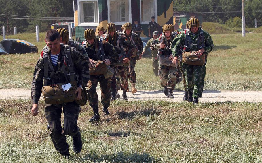 Ukrainian paratroopers move to a waiting AN-126 aircraft July 9, 2013, during an airborne operation at Exercise Rapid Trident in Yavoriv, Ukraine. The Pentagon is planning for cuts to a program used to help modernize the militaries of Ukraine and other former Soviet bloc states despite objections from U.S. European Command, which says the reductions will hinder security cooperation efforts in the region. 