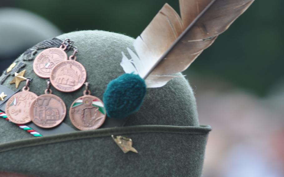 This Alpini hat, with an array of honors attached, is worn by an enlisted member. Enlisted Alpini have white feathers in their caps.