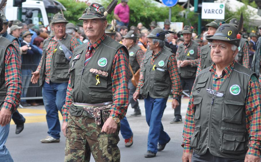 Several chapters of Alpini marching in a parade Sunday, May 11, 2014, in Pordenone, Italy, sported not only similar hats, but matching plaid shirts, vests or other clothing.