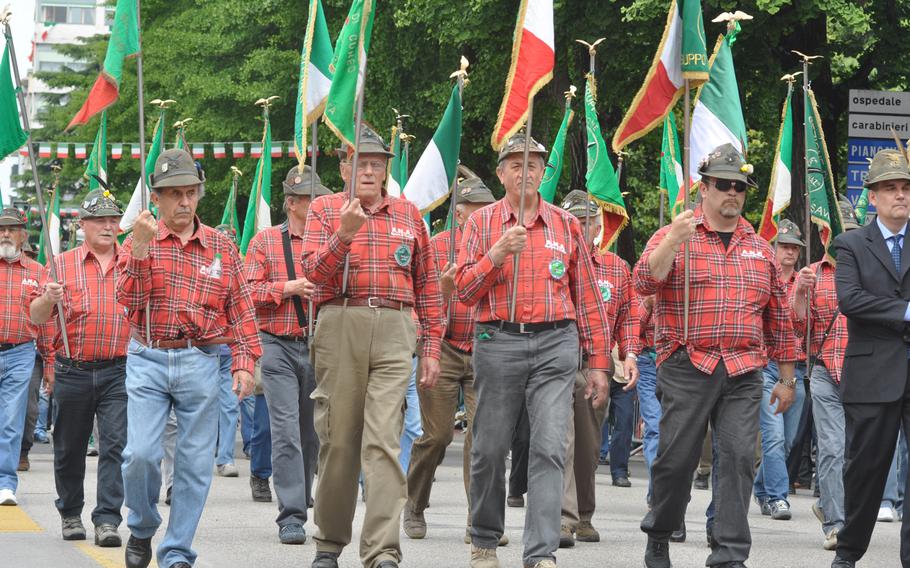 Many of the larger chapters of the Alpini that participated in a parade in Pordenone on Sunday, May 11, 2014, sported multiple banners representing the history of their groups.