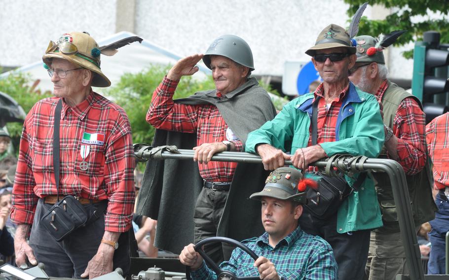 Some of those participating in an Alpini parade in Pordenone, Italy, on Sunday, May 11, 2014, rode on old military vehicles instead of marching. Many participate every year in the annual gathering. Sunday's parade capped the 87th time the event was held - the first time in Pordenone.