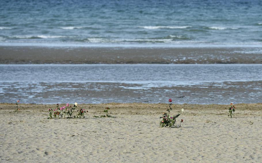 Flowers left to honor fallen soldiers at Utah Beach, Normandy during the 70th anniversary D-Day commemorations, June 5, 2014.
