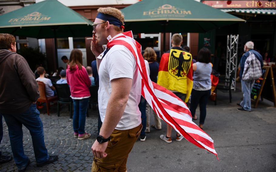An American displays his colors as he walks through the pedestrian area of Kaiserslautern, Germany while the U.S. soccer team plays Germany in the World Cup, Thursday, June 26, 2014.

Joshua L. DeMotts/Stars and Stripes