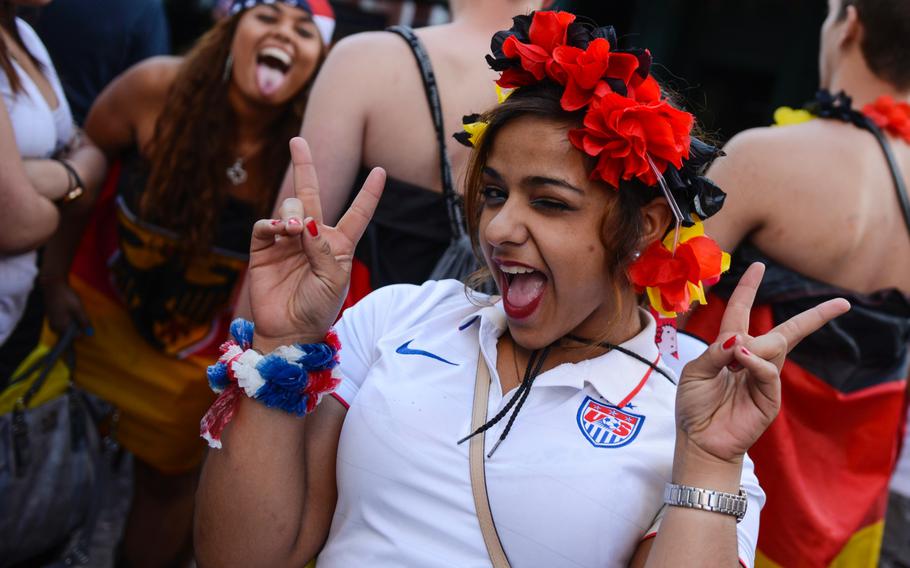 Neutral fans pose for a photograph in Kaiserslautern, Germany as the U.S. plays Germany in the World Cup, Thursday, June 26, 2014.