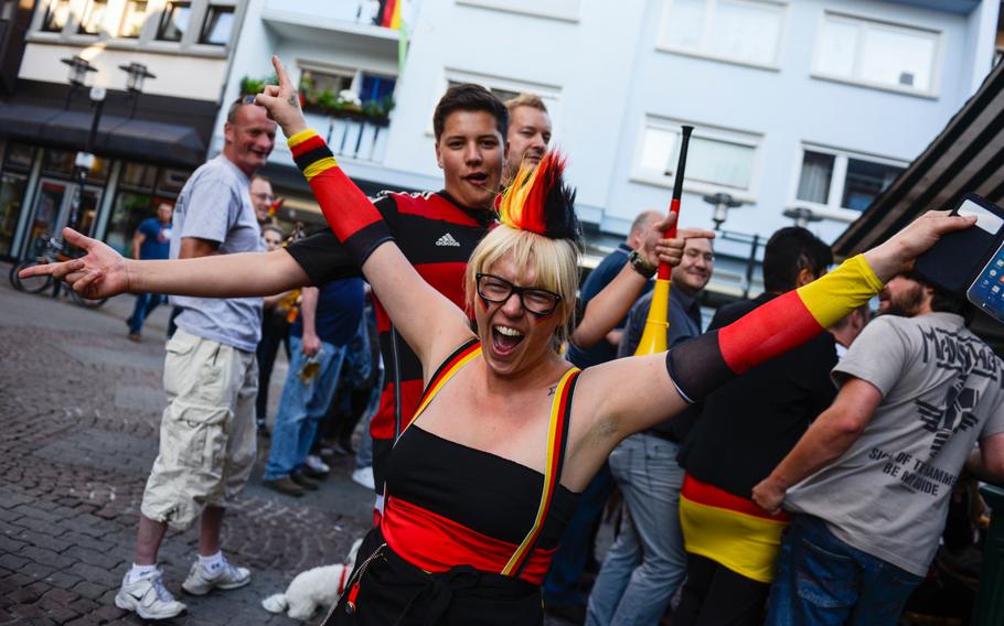 German soccer fans proudly support their team as it plays the U.S. in the World Cup, Thursday, June 26, 2014, Kaiserslautern, Germany.