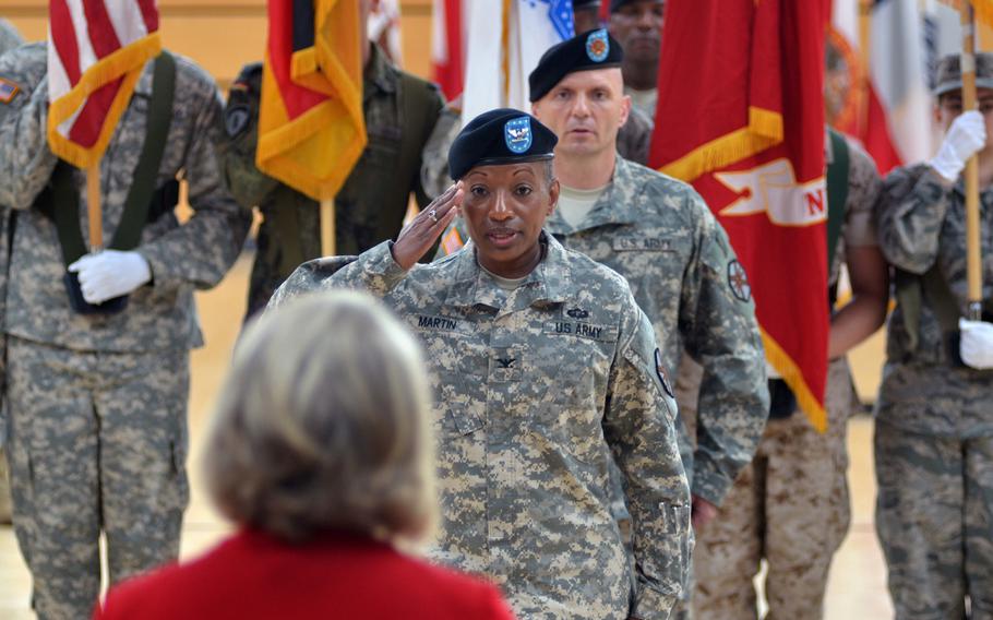 Col. Mary L. Martin salutes Kathleen Marin, European Regional Director of Installation Management Command, after assuming command of U.S. Army Garrison Wiesbaden from Col. David H. Carstens Thursday, July 10, 2014, at Clay Kaserne. 

