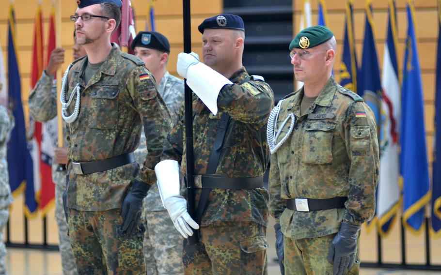 A German color guard participates in the ceremony in which Col. Mary L. Martin assumed command of  U.S. Army Garrison Wiesbaden from Col. David H. Carstens Thursday, July 10, 2014 at Clay Kaserne.

