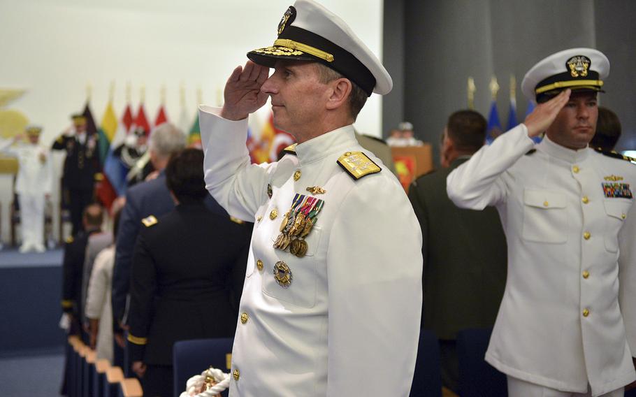 Adm. Jonathan W. Greenert, Chief of Naval Operations, salutes as he enters the theater in Lago Patria, Italy, for a change of command ceremony. Adm. Mark E. Ferguson III relieved Adm. Bruce Clingan as commander of U.S. Naval Forces Europe-Africa and Allied Joint Forces Naples.