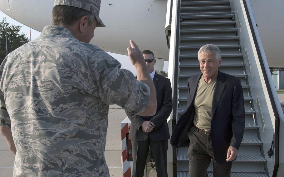 Commander, U.S. European Command, General Philip Breedlove greets Secretary of Defense Chuck Hagel upon his arrival  at U.S. Army Airfield in Stuttgart, Germany, August 6, 2014.